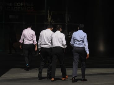 Officer workers walking in the Central Business District of Singapore. 