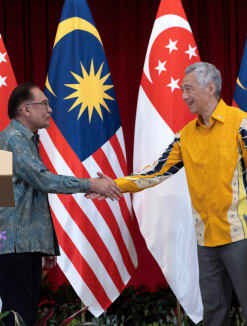 Prime Minister Lee Hsien Loong and his Malaysian counterpart Anwar Ibrahim shake hands after a joint press conference at the Istana on Oct 30, 2023, where they held their Leaders' Retreat.