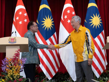 Prime Minister Lee Hsien Loong and his Malaysian counterpart Anwar Ibrahim shake hands after a joint press conference at the Istana on Oct 30, 2023, where they held their Leaders' Retreat.