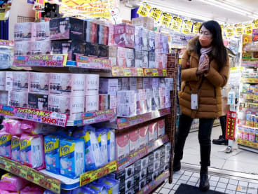Woman shops at a pharmacy of a market in Tokyo, Japan March 3, 2023. REUTERS/Androniki Christodoulou/ File photo