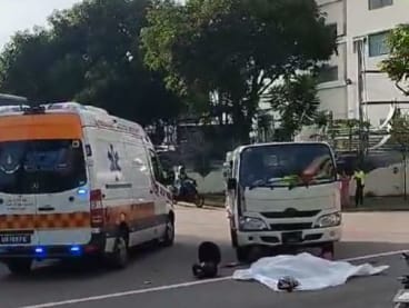 A screengrab of a video on TikTok showed a white tarp, presumably used to cover the body of the motorcyclist, on the ground in front of a lorry.